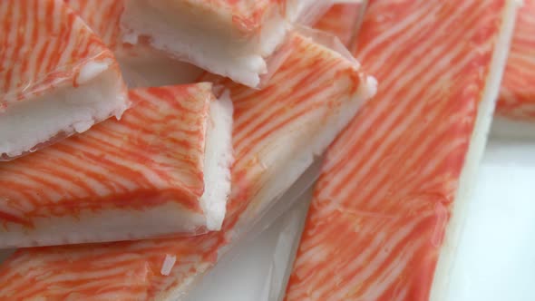 Crab Sticks Rotate on a Plate As Background Delicious and Juicy Crab Meat Rotates on a Plate Crab