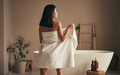 Back view of attractive asian slim woman in towel going to take bath in white bathtub - PhotoDune Item for Sale