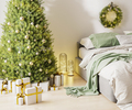 Christmas three with ornaments, festive lights and white and golden gift boxes in room interior - PhotoDune Item for Sale