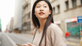 Attractive Asian woman enjoying walk among street exploring new city alone - PhotoDune Item for Sale