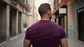 Back of attractive muscular man dressed casual walking down the narrow street. Beautiful guy walking - PhotoDune Item for Sale