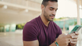 Attractive man texting on smartphone with friends while waiting them outdoor - PhotoDune Item for Sale