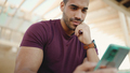 uscular man dressed casual checking his social media using smartphone outdoors - PhotoDune Item for Sale