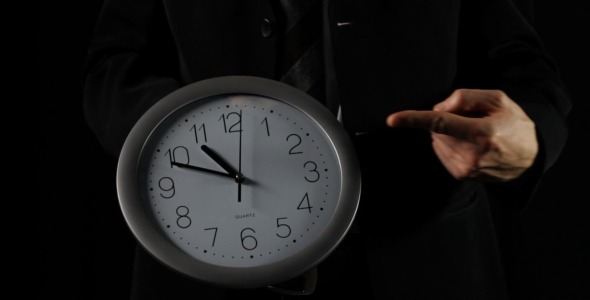 Businessman Shows Time On Clock (black)