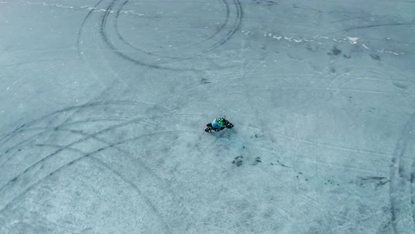 Aerial Drone Footage of a Motorcyclist Riding in a Dry Lakebed