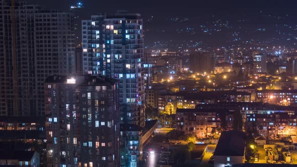 Multistorey Buildings with Changing Window Lighting At Night in City. Timelapse