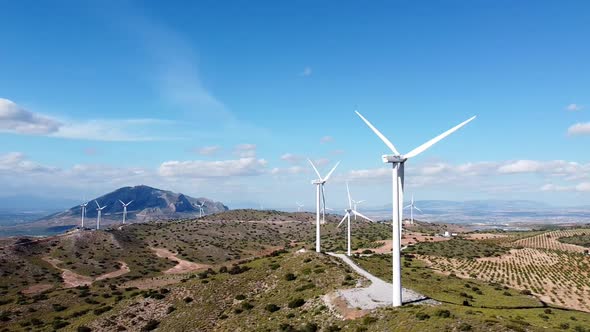 Windmills rotating in Spanish wind farm drone shot, aerial view of wind mill in Spain.