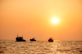 Fishin industry boats at sea back to port at sunset - PhotoDune Item for Sale