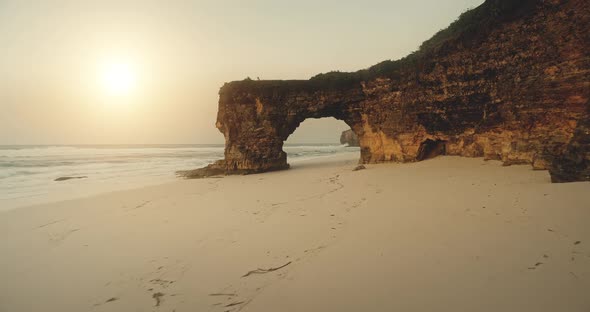 Sand Ocean Beach at Sun Light with Cliff Shore Aerial View