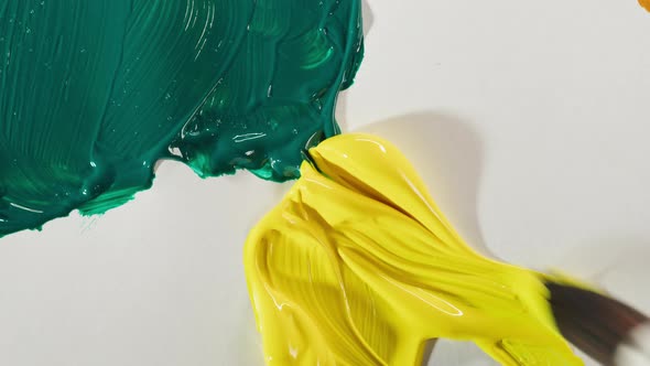 Mixing Green and Yellow Paints Closeup