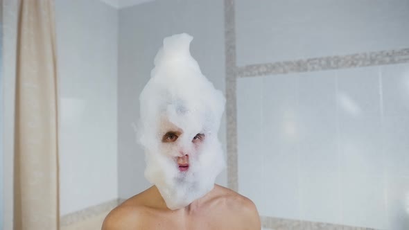 Man in a Soapy Foam Dancing in a Bath