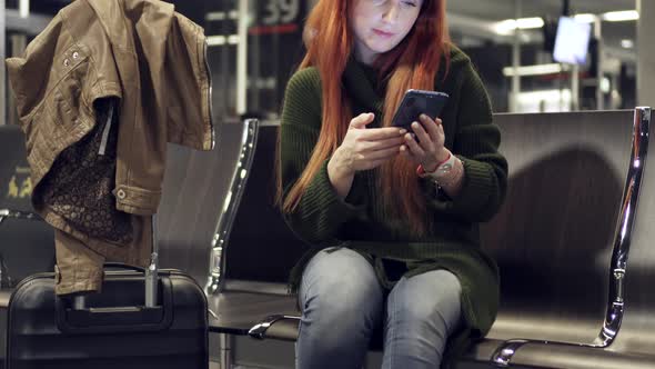 Female Is Waiting for Delayed Flight at Night Airport