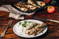 Baked hake carcasses with rice - PhotoDune Item for Sale