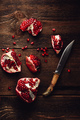 Pomegranate pieces with knife - PhotoDune Item for Sale
