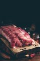 Raw pork loin joint on cutting board - PhotoDune Item for Sale