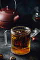 Steeping red tea in glass mug - PhotoDune Item for Sale
