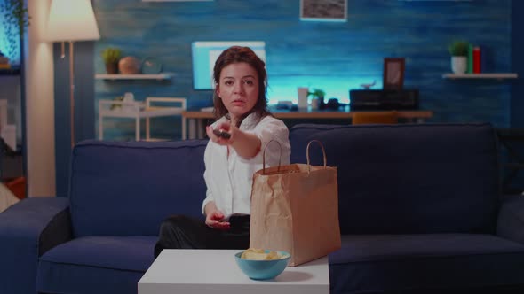 Adult Unpacking Fast Food Meal From Delivery Bag on Table