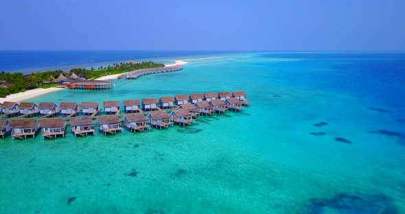 Wide fly over tourism shot of a white paradise beach and turquoise sea background in high resolution