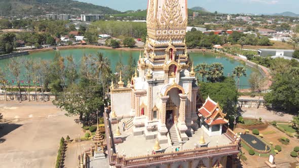 Orbit View over top floor terrace of Wat Chalong Pagoda Temple in Phuket, Thailand 