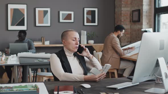 Female Designer Talking on Cellphone