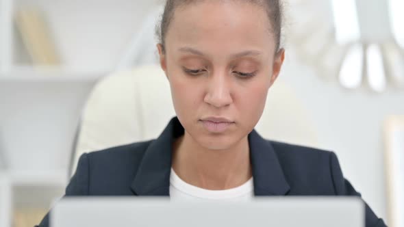 African Businesswoman Working on Laptop