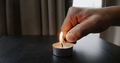 Ignite candle with lighter on table - PhotoDune Item for Sale