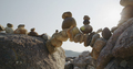 Arch of pebbles in balancing on the sea coast - PhotoDune Item for Sale