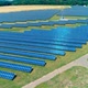 Aerial View. Flying Over The Solar Power Plant With Sun. Solar Panels And Sun - VideoHive Item for Sale