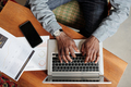 Top view of hands of young black man over laptop keyboard - PhotoDune Item for Sale