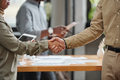Close-up of handshake of two young intercultural business partners - PhotoDune Item for Sale