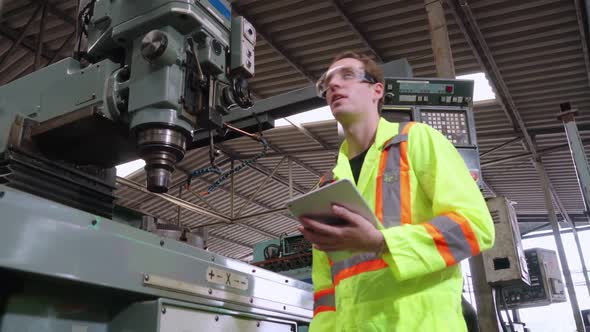 Factory Worker Warn Coworker About Safety and Give Hardhat to Him