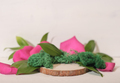 wooden saw cut podium for product presentation with floral decor, green leaves, moss and petals  - PhotoDune Item for Sale