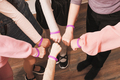 hands of girls with same bracelets, team building, cooperation, support and teamwork.  - PhotoDune Item for Sale