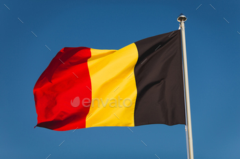 d blue sky. Flag of Belgium, capital Bruxelless. National symbol of Kingdom of Belgium