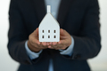 Holding the model house, real estate insurance and banking concept - PhotoDune Item for Sale