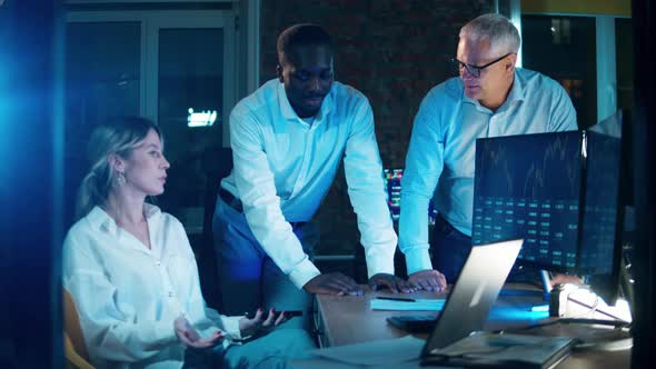 A Group of Stockbrokers are Discussing the Stock Rates