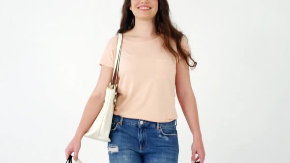 Portrait of smiling woman holding a shopping bag