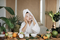 Attractive young asian lady applying cotton face mask - PhotoDune Item for Sale
