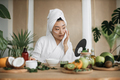 Healthy asian woman preparing cream and applying on face. - PhotoDune Item for Sale