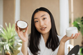 Blogger or content creator asian woman preparing natural cosmetics at home - PhotoDune Item for Sale
