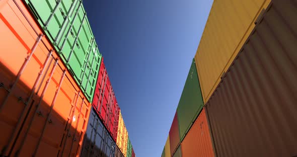 Rows of Shipping Containers Under Clear Sky Seamless Loop