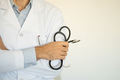 Doctor holds his stethoscope - PhotoDune Item for Sale