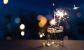 Sparklers on New Year's Eve with city background - PhotoDune Item for Sale
