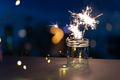 Sparklers on New Year's Eve with city background - PhotoDune Item for Sale