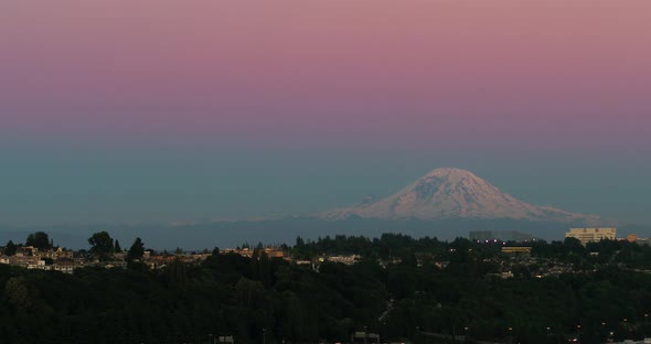 Aerial shot from Seattle's perspective of Mount Rainier at sunset.