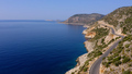 Spectacular view from drone of mountain road near the turquoise sea or ocean. - PhotoDune Item for Sale