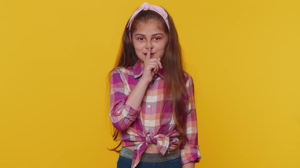 Preteen Child Girl Presses Finger to Lips Makes Silence Hush Sign Do Not Tells Gossip Secret Quiet