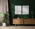 Two blank poster frames mock up on green wall with sunlight, modern room interior  - PhotoDune Item for Sale