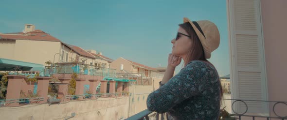 A young woman on the balcony