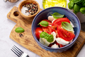Caprese salad with ripe tomatoes, mozzarella and garden basil - PhotoDune Item for Sale